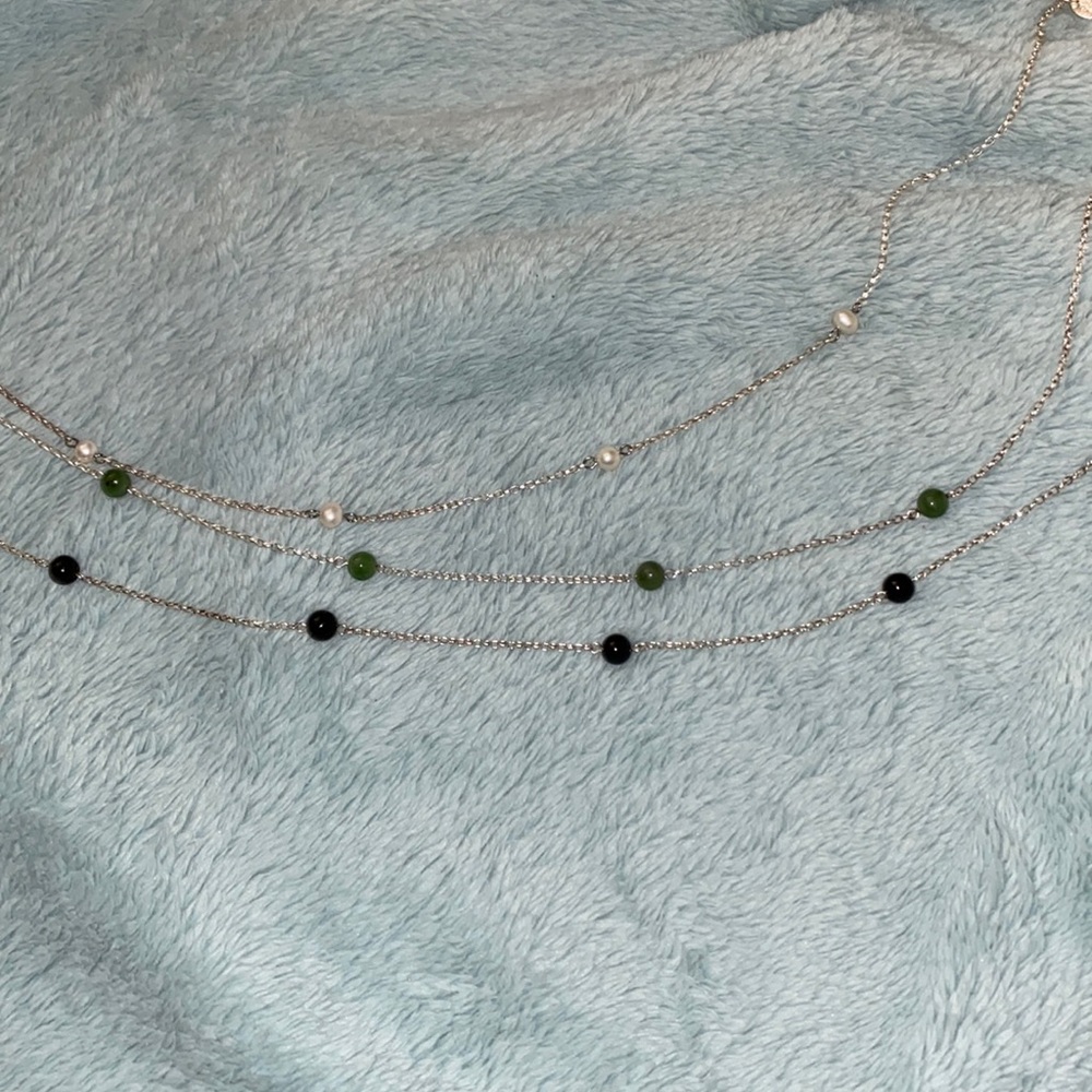 White, green, and black bead necklaces
